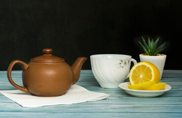 tea composition of a tea party with a teapot and lemon