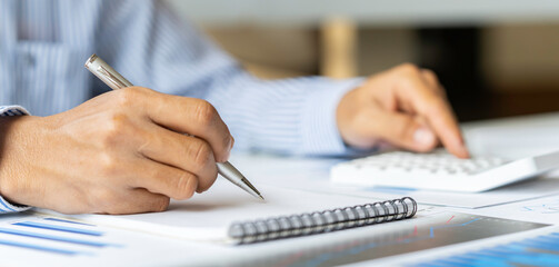 Close up of male accountant or banker making calculations. Savings money, Annual tax calculation...