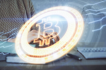 Double exposure of woman hands typing on computer and crypto market theme hologram drawing. Blockchain concept.