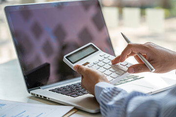 A businessman that operates on the table being checking data, Concept financial transactions online of a businessman, Financier being check about financial transaction past computer with teamwork.