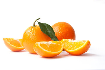 Orange fruit with slices and leaves isolated on white background. Fresh citrus composition.