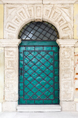 Old vintage green metal door.