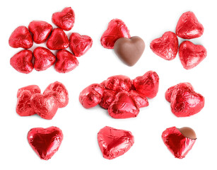 Set with delicious heart shaped chocolate candies on white background
