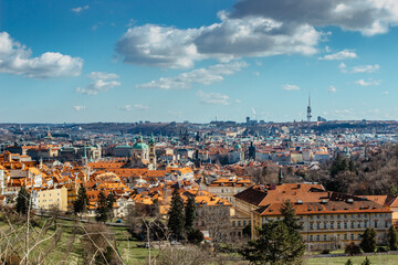Fototapeta na wymiar Aerial postcard view of Prague,Czech Republic. Prague panorama.Beautiful sightseeing on sunny spring day.Amazing European cityscape.Red roofs,TV tower,historical houses.Travel urban scenery.