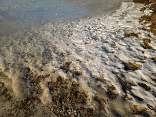 Frozen shoreline on Norton Pond in Maine in the winter.
