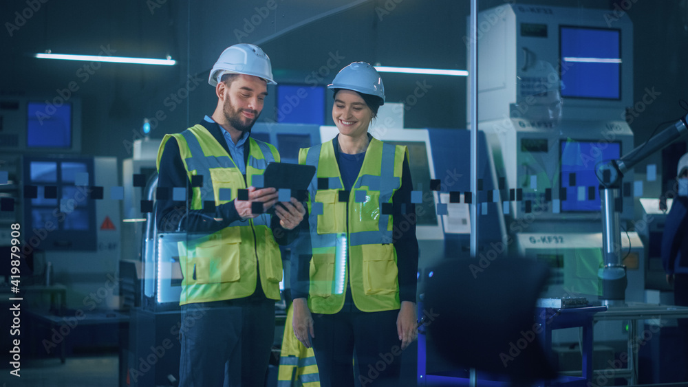 Poster modern factory: female and male engineers wearing safety jackets, hardhats standing in industrial wo