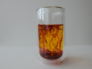 water in a glass colored with manganese, beautiful patterns