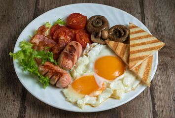 homemade country food, full english breakfast, fried egg with sausage and toast