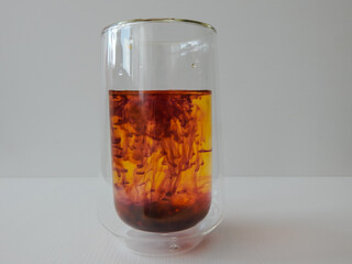 water in a glass colored with manganese, beautiful patterns