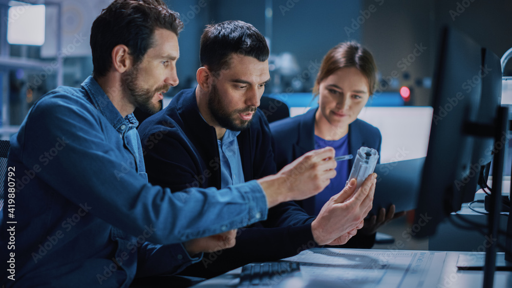 Fototapete Industry 4.0 Modern Factory: Team of Innovative Industrial Engineers Use Computer and 3D Printer to Build Complex Component. Group of Scientists Use High-Tech Machinery for Futuristic Design