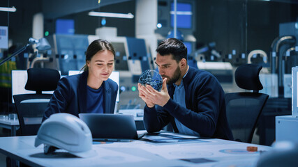 Industry 4.0 Modern Factory Meeting Room: Chief Engineer Holds Mechanism, Shows it to Female...