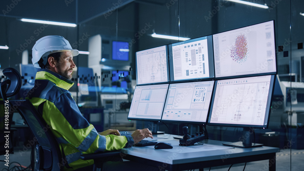 Poster Industry 4.0 Modern Factory: Facility Operator Controls Workshop Production Line, Uses Computer with Screens Showing Complex UI of Machine Operation Processes, Controllers, Machinery Blueprints