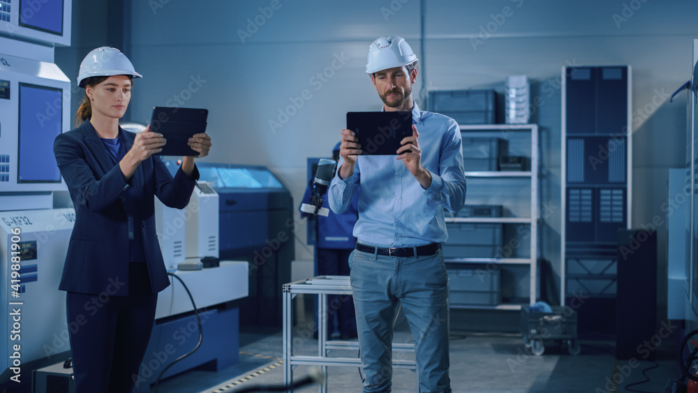 Aufkleber Portrait of Two Professional Engineers Use Industrial Digital Tablets to Work with Augmented Reality. Great Template Shot for Augmented Reality. Factory Workshop with CNC Machinery.