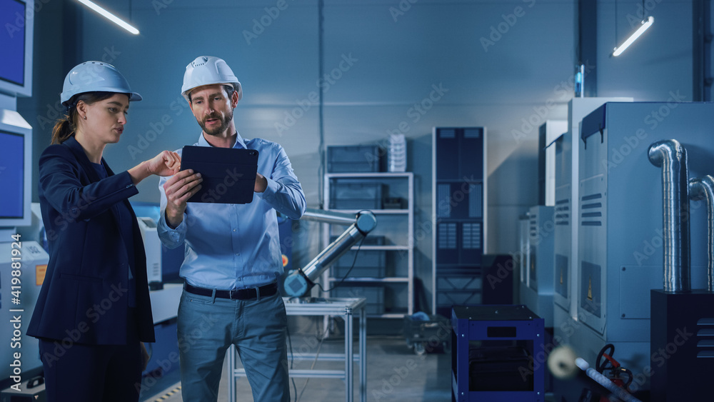 Leinwandbilder Portrait of Two Professional Engineers Use Industrial Digital Tablet to Work with Augmented Reality. Great Template Shot for Augmented Reality. Factory Workshop with CNC Machinery.