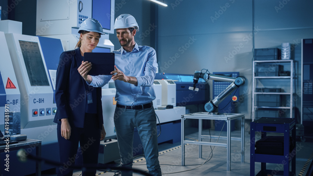 Fototapete Portrait of Two Professional Engineers Use Industrial Digital Tablet to Work with Augmented Reality. Great Template Shot for Augmented Reality. Factory Workshop with CNC Machinery.