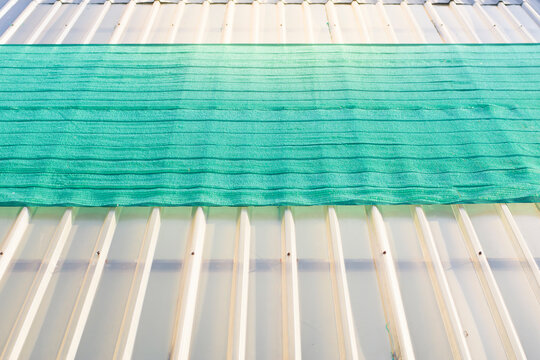 Clear roof with a green slan on top