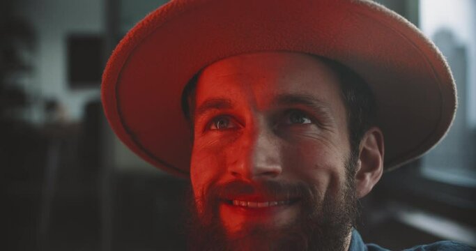 portrait of a man with a hat smiling