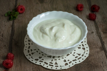 homemade yogurt in a white bowl on a wooden table