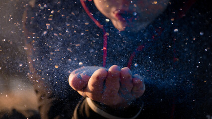 hand with glitter explosion