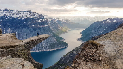 Naklejka premium Beautiful hike in the middle of the wilderness in Norway.One of the most famous hikes in the world with a rewarding view from the tongue of the troll, a very unique stone formation