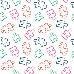 Seamless pattern with the image of multi-colored puzzle pieces. Funny print. Design for textiles, decor and paper.
