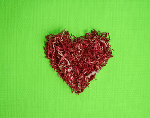 Red Cabbage heart on a green background