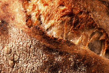 Crust of homemade artisan bread close-up, texture of freshly baked wheat bread - 419886516