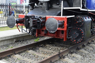 Retro steam locomotive stands at the station