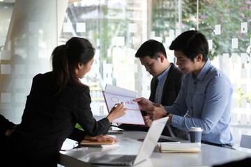 Business people in the office are planning a strategy for the future of the business.	