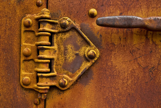 Closeup of an old rusted door handle with hinge on an old train at the Snoqualmie Train Museum, Washington.