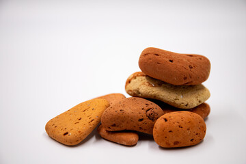 Stacked smooth red-brown sea pebbles. Balancing pebbles isolated on white background