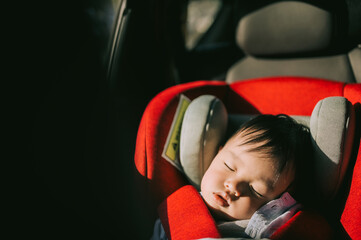 Portrait of toddler boy sleeping in car seat,Safety Car Seat