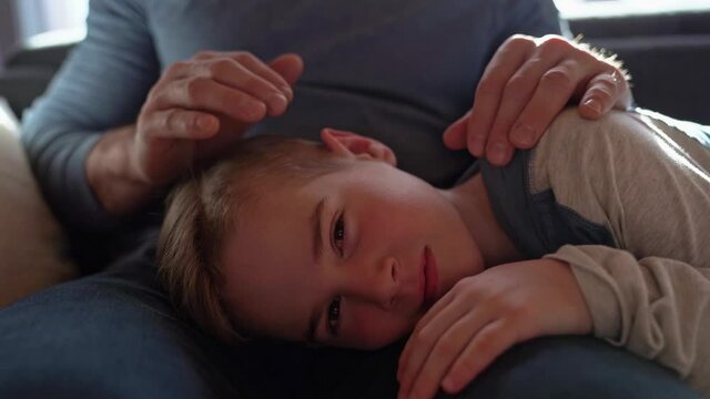 son with problem sit on the father knee