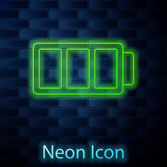 Glowing neon line Battery charge level indicator icon isolated on brick wall background. Vector