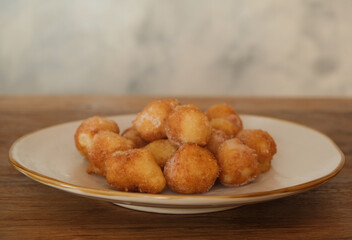 Typical Carnival italian Fritters, Sweet Dough Balls with Icing Sugar, Italy