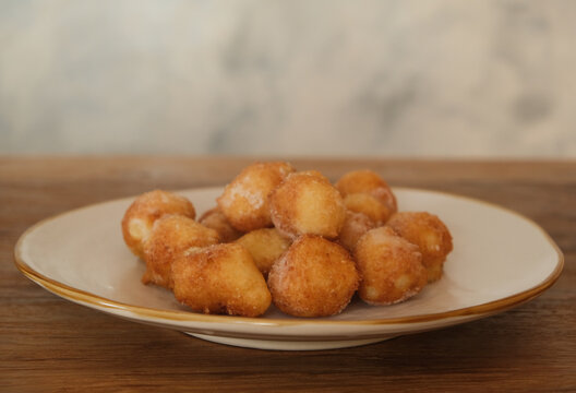 Typical Carnival italian Fritters, Sweet Dough Balls with Icing Sugar, Italy