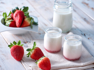 fresh strawberries, natural yogurt and a glass of milk