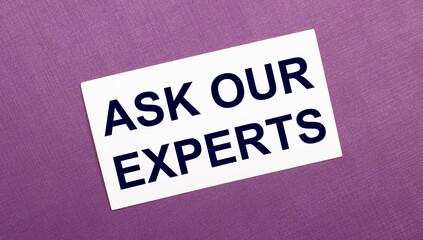 On a lilac background, a white card with the words ASK OUR EXPERTS