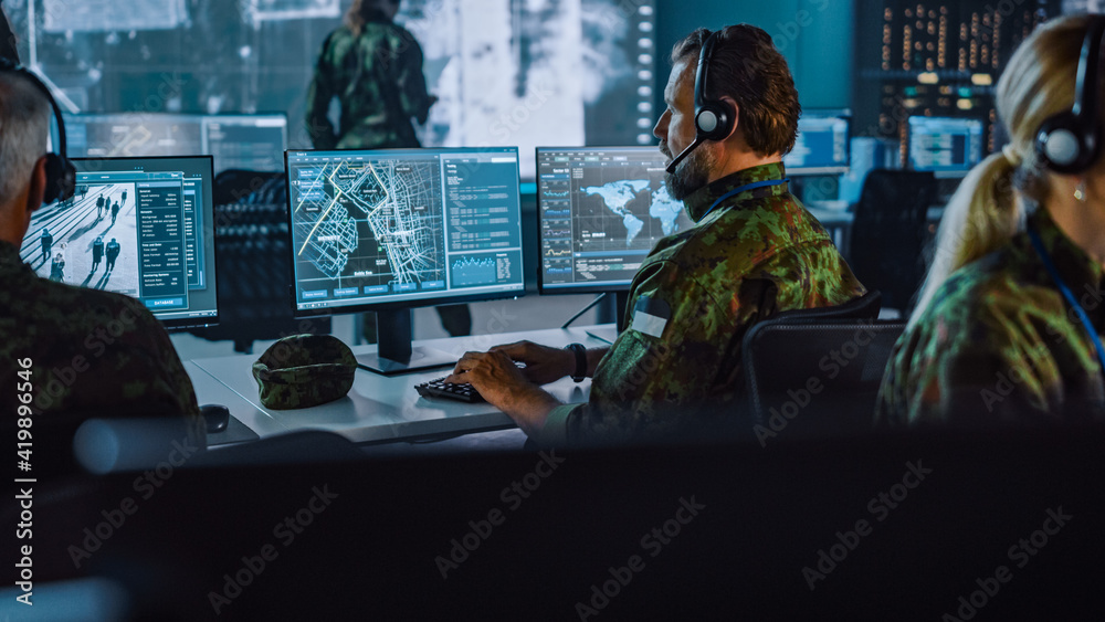 Aufkleber military surveillance officer working on a city tracking operation in a central office hub for cyber