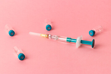 Syringe with several medical vials for injection.