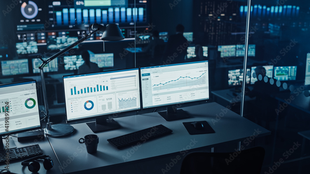 Aufkleber Two Digital Computer Screens with Financial Analytical Data in Modern Monitoring Office. Control Room with Finance Specialists Sit in Front of Computers. 
