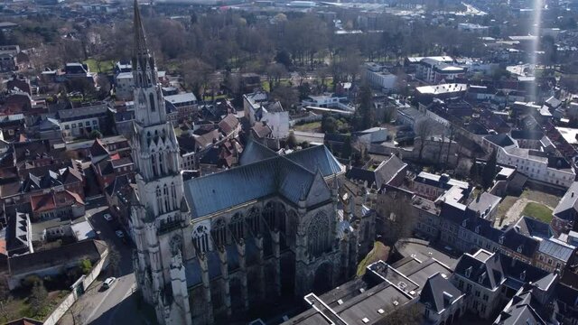 Aerial circling shot of Basilica Our Lady Saint Cordon, Valenciennes