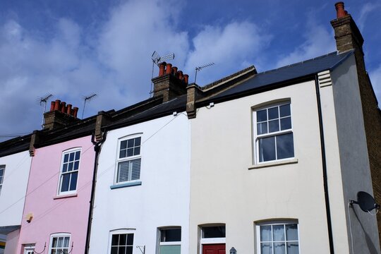 Multicoloured terraced cottages in village in the South East of England
