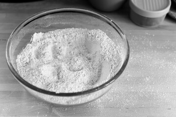 Raw ingredients of flour and yeast for making a loaf of bread at home