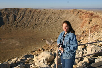 Woman Exploring at Meteor Crater, or Barringer Crater,  Arizona From Asteroid Hitting Ground in...