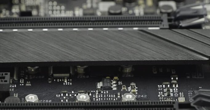 Truck shot of M.2 heatsink socket. Circuit board with capacity, Computer Motherboard with electronic capacity components device