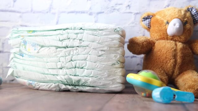 stack of baby diaper on table,
