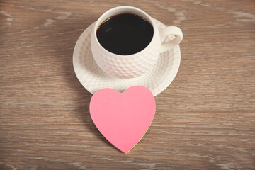 Fototapeta na wymiar pink hearts on cup of coffee