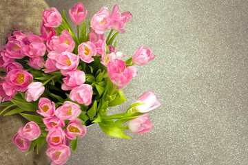 bouquet of tulips on gray background. Bunch of fresh-cut spring flowers