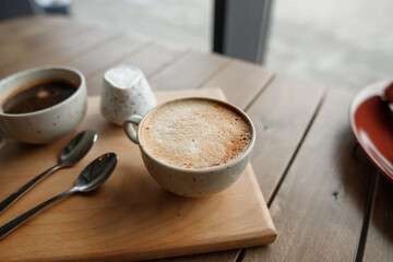 cup of fragrant coffee on a wooden table
